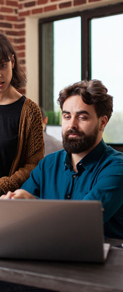 Couple reviewing a plot loan